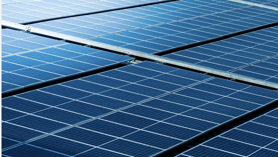 Rows of installed solar panels on a rooftop array